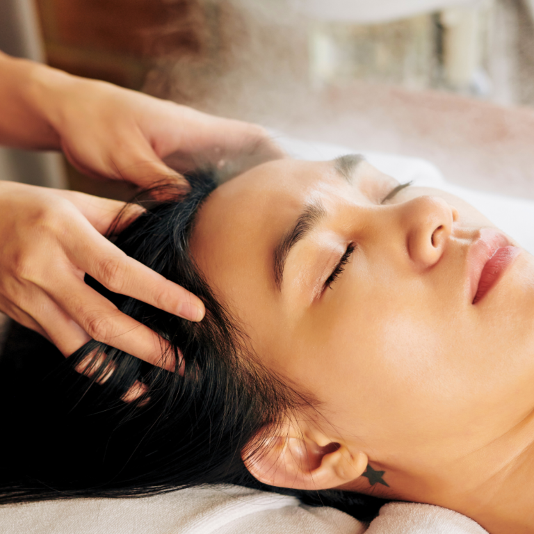 woman receiving scalp massage