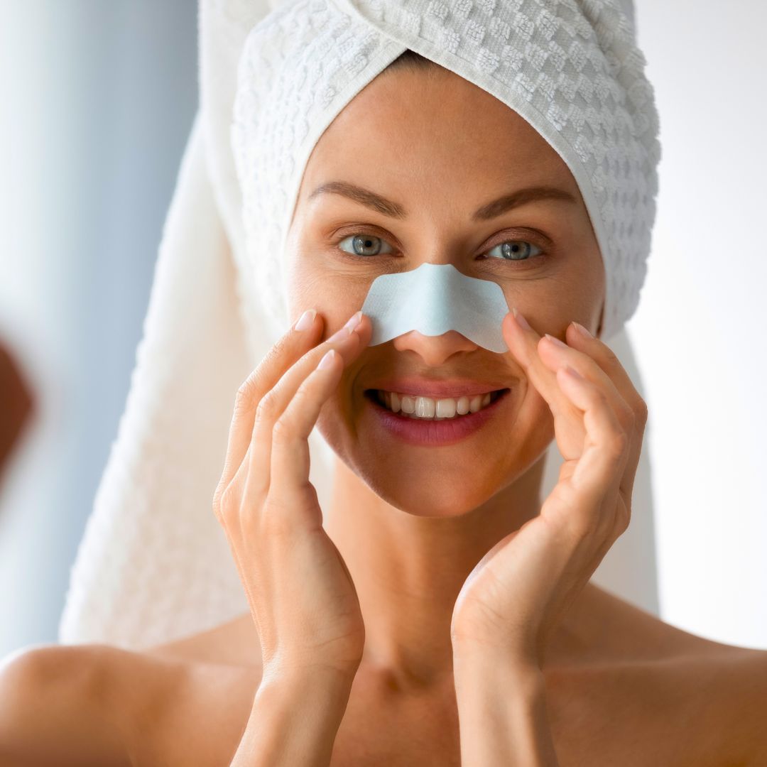 woman with pore strip on nose